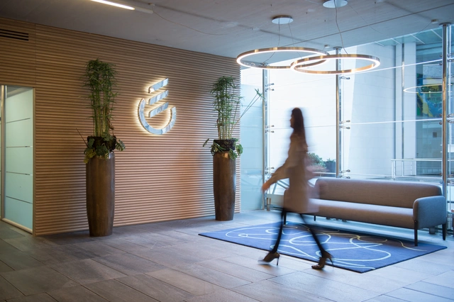 Hall with logo and employee